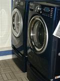 Tromm washer & dryer on pedestals.