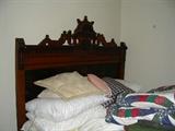 Eastlake bedroom suite consisting of dresser with mirror and matching bed.