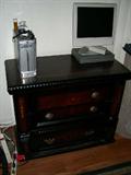 Chest of drawers, computer and laptop