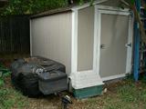 Shed is for sale, as is the motorcycle trailer.