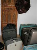 Luggage, sewing machine, carved screen.