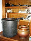 Brass and copper pots. Telephones.