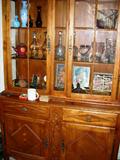 China cabinet, decanters, glassware.