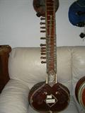Beautifully inlaid sitar, one of two.