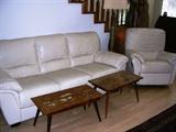 Living room furniture including sofa, rocker/recliner, love seat, arm chair and footstool. Two coffee tables.