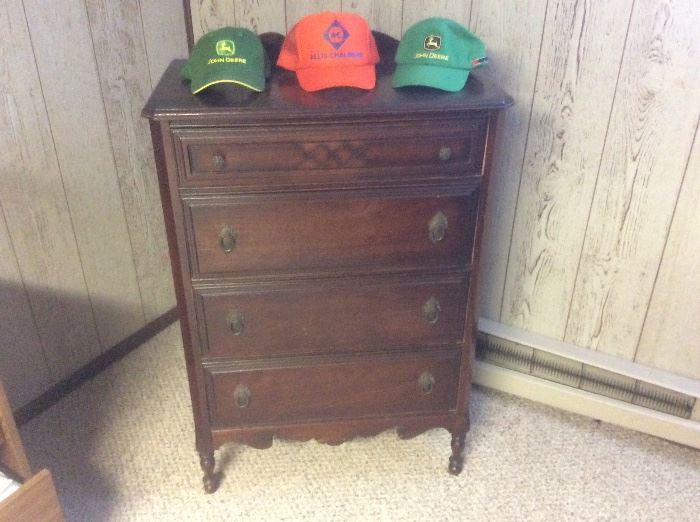 Older chest of drawers, John Deere caps