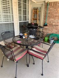 Wrought iron patio table with 4 chairs