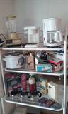 Small Kitchen Appliances: Gevalia/Krupps Coffe-Maker, Assorted Small Coffee Pots, Presto Food Processor, Can Openers, Crock Pot, Blender, Forman Grill, and more