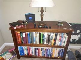 TV Room:  Wood Book Case, Books--Running, Scuba Diving, Hiking, Camping