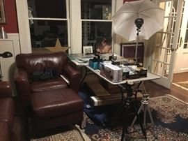 Leather Chair and Ottoman, camera cases in chair.