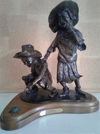 Boy Girl Turtle Sculpture Called Die Diversions
