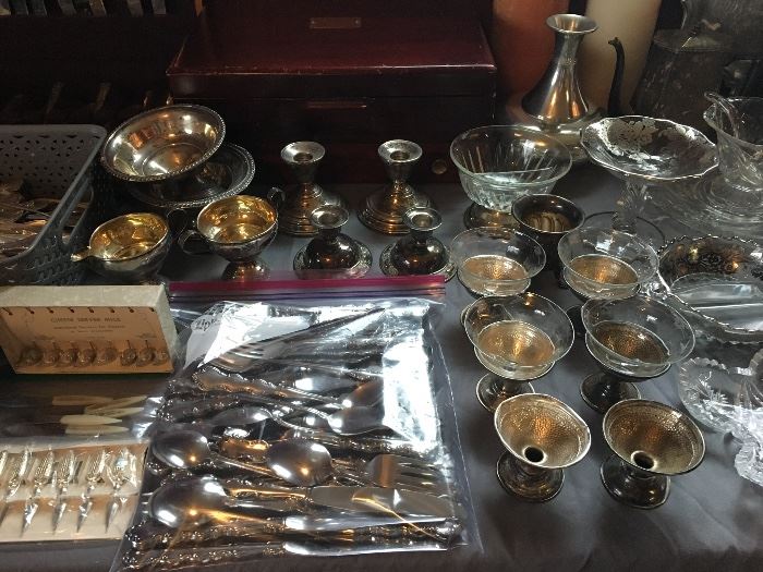 Oneida Mozart deluxe flatware in the bag , assorted sterling candlesticks, compotes, and more. 