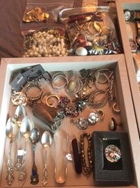 Good selection of jewelry, including Chicos and sterling pieces.   Sterling spoons. 