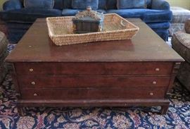 Coffee table with collection drawers