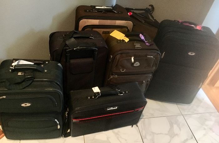 Various lightweight suitcases with pull handles