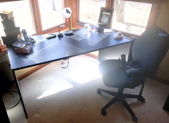 Black  work surface desk
Office chair