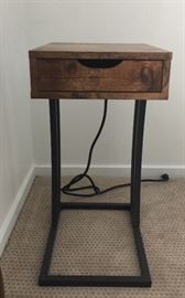 One of two bedside tables - wood and metal w/one drawer w/lamp and phone outlets attached in back