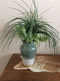 Faux plant in heavy clay vase