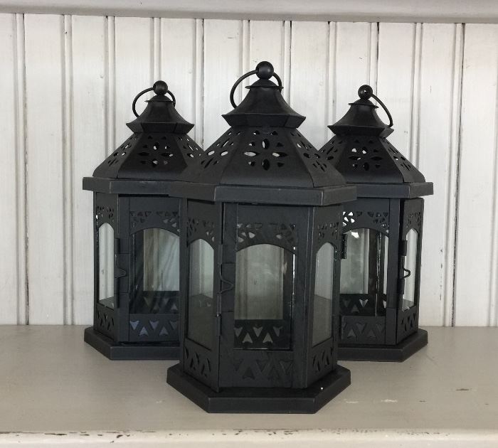 Three metal candle lanterns