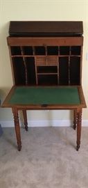 Early 1900"s Plantation Desk, this picture showing the top lip opens for storage and features 6 small slots for mail storage  and 4 vertical slots for documents. This piece was moved from home to fields where the Aides-De-Camp would record the daily receipts and work documents.