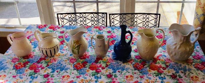 Assortment of sizes and styles of Pitchers from  "Kitty’s" Personal Collection. This is a small sampling of the many from her collection.  Be sure to visit all rooms in the home where you will find more of these unique and some one of a kind Pitchers.