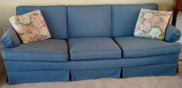 Retro 108” long 3-Cushion Blue Sofa located in the family room.  This piece has a matching accent Swivel Rocking Chair.