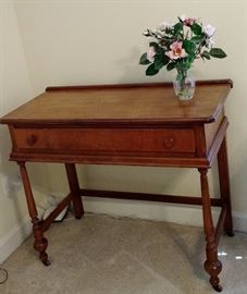 Antique Side Table, Hall Table, or Desk. This piece is so universal can adapt to any room in the home. Rosewood Mahogany and has original casters. Very nice piece! 