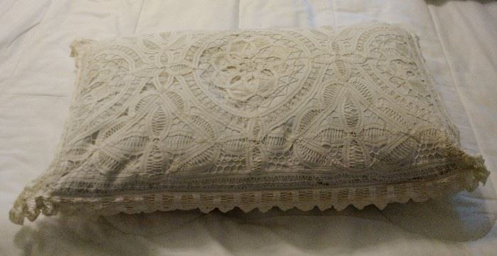 Beautiful ecru hand knitted pillow case on a standard pillow.  The craft that went into making this piece is exceptional.