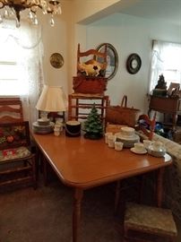 Dining  table and 6 ladder back chairs.  Ceramic tree and antique basket.