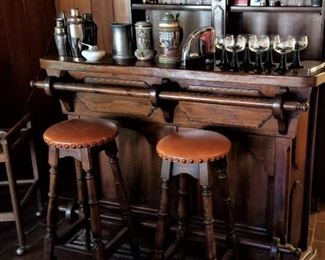 Nice bar with two stools - plenty of shelving/storage