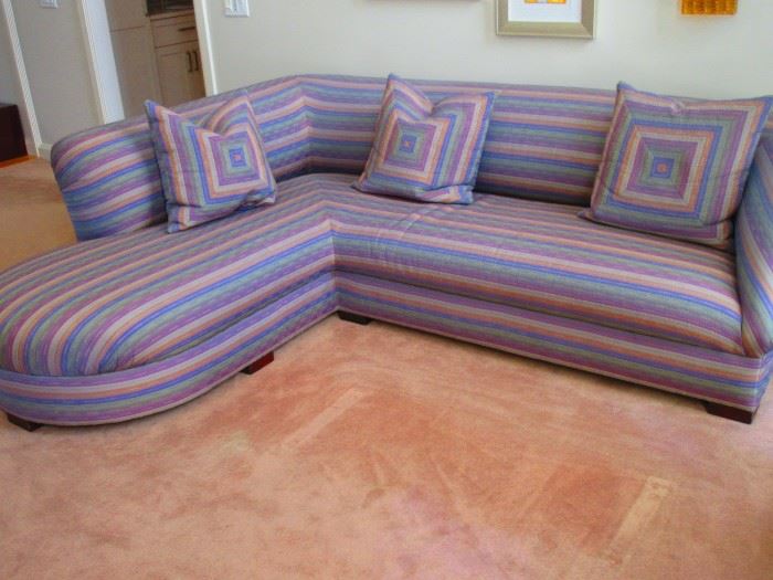 One of a pair of contemporary quilted sectional sofas