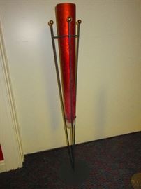Contemporary glass vase in iron stand