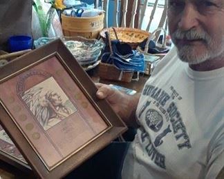 Gene show one of the framed coin collections