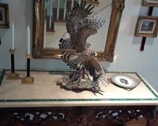 Large and dramatic Boehm hawk, entry table with carved frieze