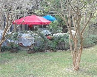 There are six tables filled with kitchen, collectible, and assorted items. Some are priced individually and others are priced in box lots.