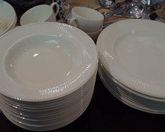 Wedgwood soups, plates, and several serving pieces.
