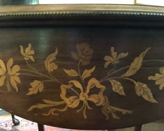 Inlay work appears on several tables and chests