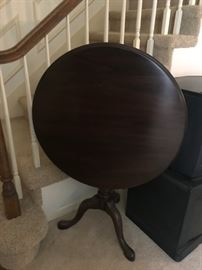 #38	flip round  top  pedestal end table 30x27-42 tall 	 $100.00 
