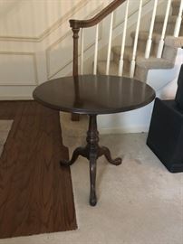#38	flip round  top  pedestal end table 30x27-42 tall 	 $100.00 
