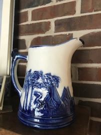 #39	Indian head  and tepee blue and white vintage pitcher 9 in tall as is chip 	 $60.00 
