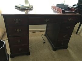 #59	leather top 7 drawer desk mahogany 	 $125.00 
