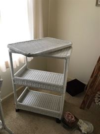 #68	wicker tv stand on wheels w 2 shelves  w swivel top 27x16x37	 $100.00 
