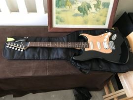 #100	fender Starcaster 15G amp and electric guitar 	 $100.00 
