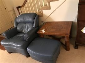 #35	Handcock &Moore blue leather chair that reclines and ottoman nail head front 	 $400.00 
