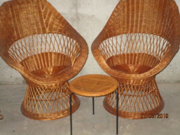 pair of wicker chairs with deep seats and wicker table