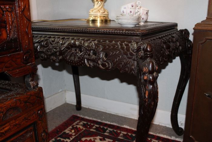 heavily carved table