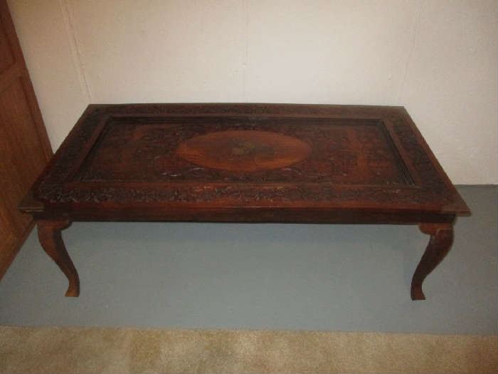 Inlaid and carved coffee table