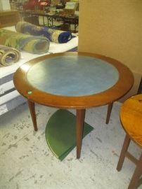 Round game table with leather insert