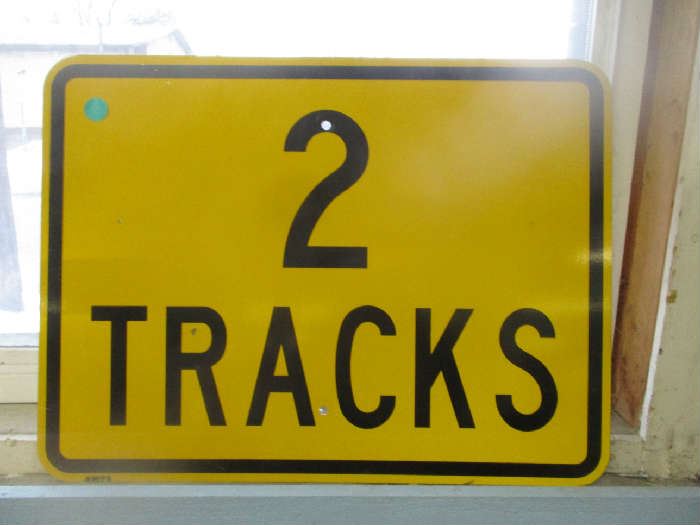 Metal railroad sign