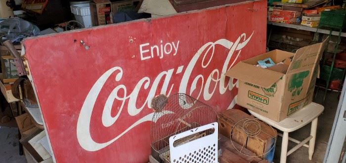 large original Coca-Cola metal sign on frame, was used in a store to close over a window